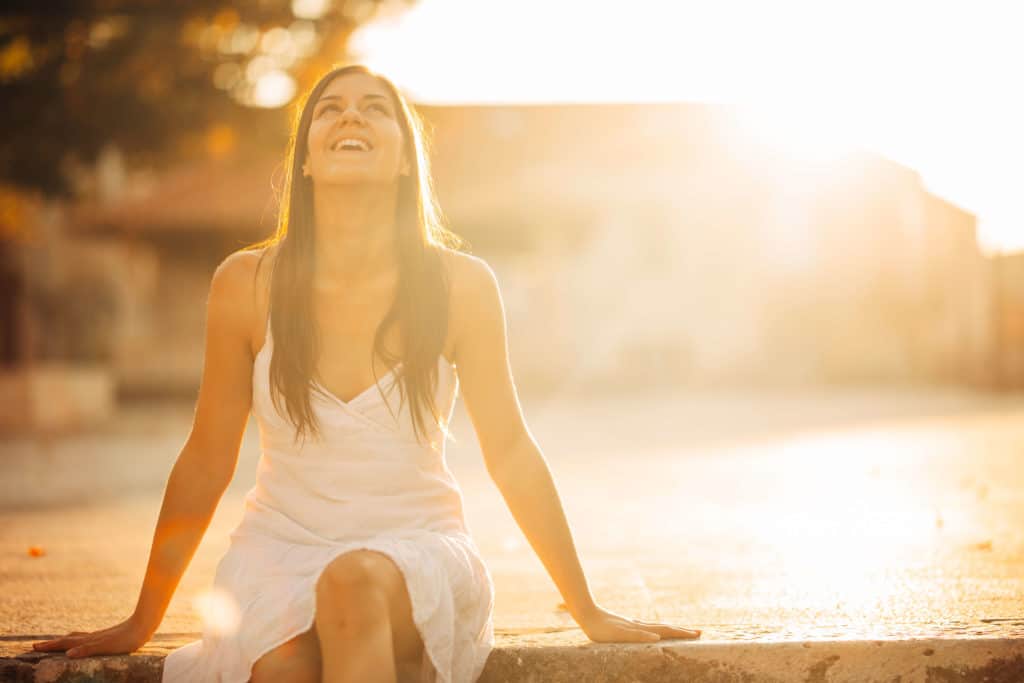 A carefree woman enjoying nature after receiving Obsessive-Compulsive Disorder Treatment in Worcester.